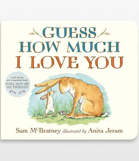 Children's book cover titled 'Guess How Much I Love You' by Sam McBratney, illustrated by Anita Jeram, showing a large brown rabbit comforting a small white rabbit on a cream background, included in our Maternity Gift set.